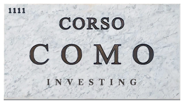 The Corso Como street plaque in white Carrara marble, with bronze letters reading Corso Como, the number 1111, and Investing